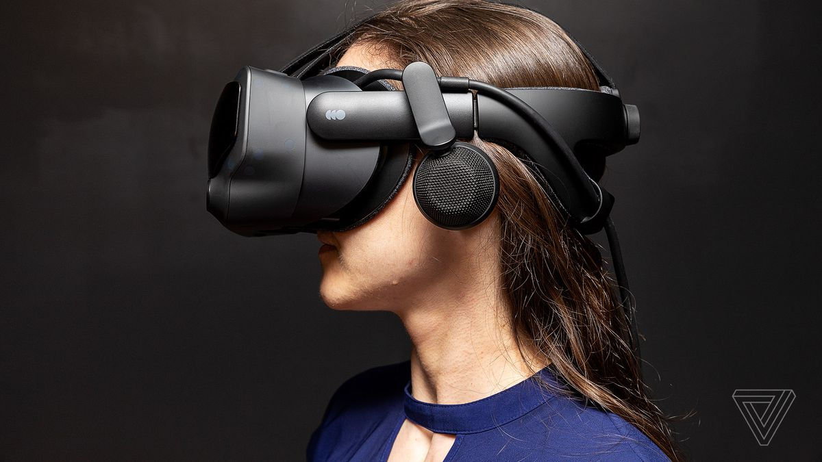 Woman with long hair wearing Valve Index VR sideview